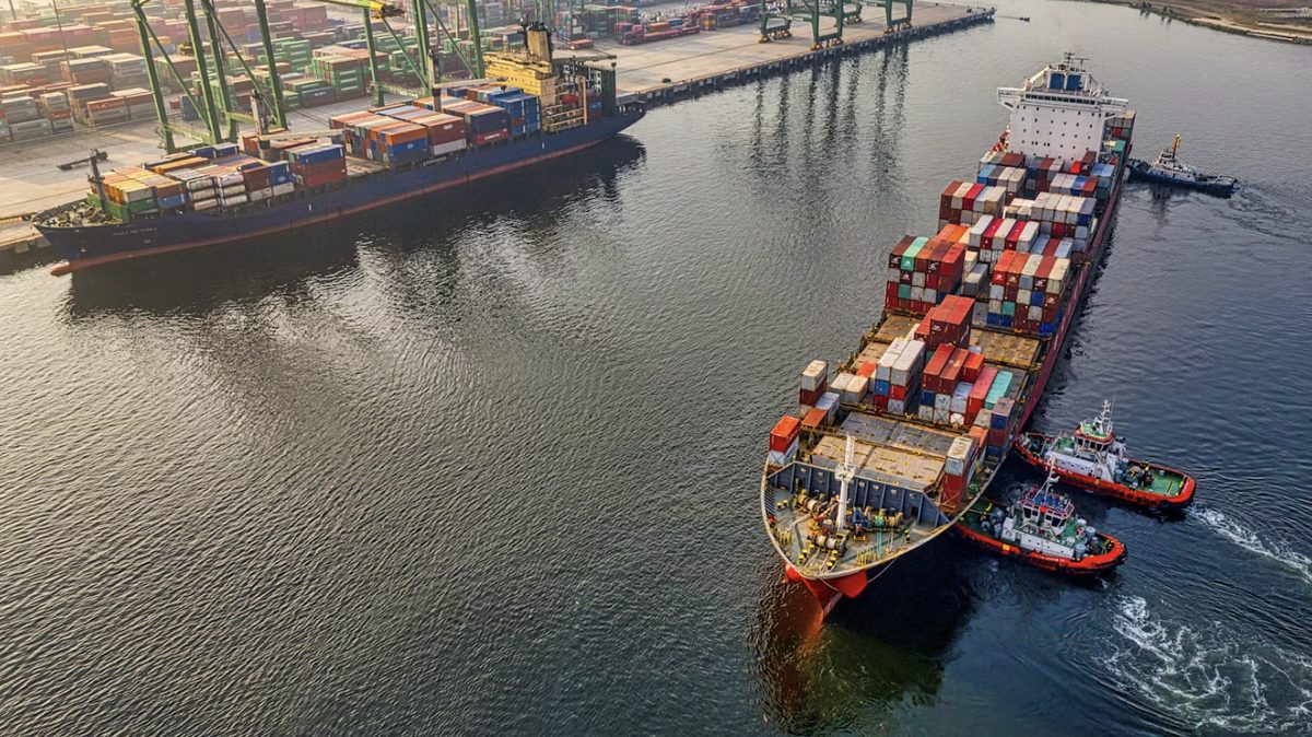 Vessel departing with tug escort